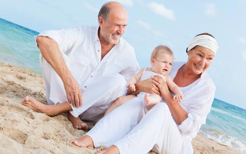 Seniors and children summer heat beach sun