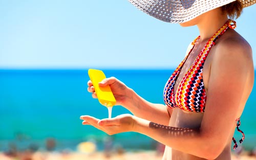 Sunscreen on the beach summer heat and sun